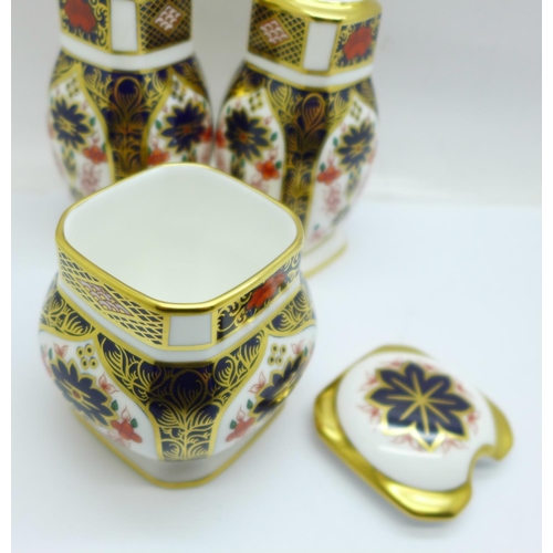 703 - A Royal Crown Derby 1128 pattern three piece cruet set