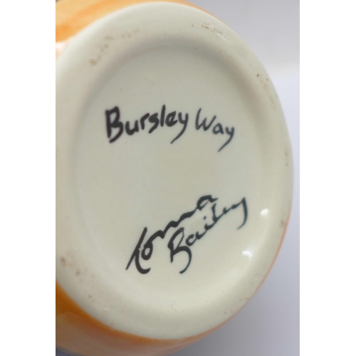 720 - A Lorna Bailey bulbous vase in the Bursley Way design, 18cm, signed 'Lorna Bailey' on the base