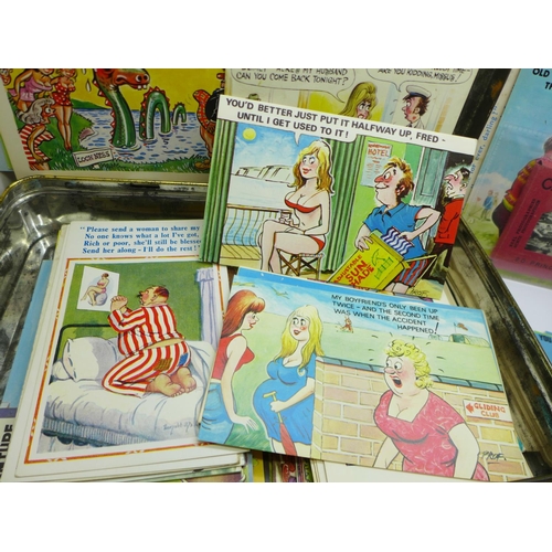 731 - A tin of seaside humorous postcards (approximately 130)