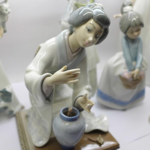 742 - Two Lladro figures, a/f, three Nao figures, two a/f, and two others