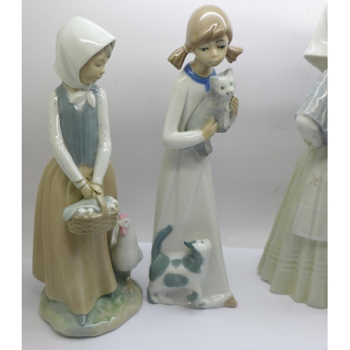 742 - Two Lladro figures, a/f, three Nao figures, two a/f, and two others