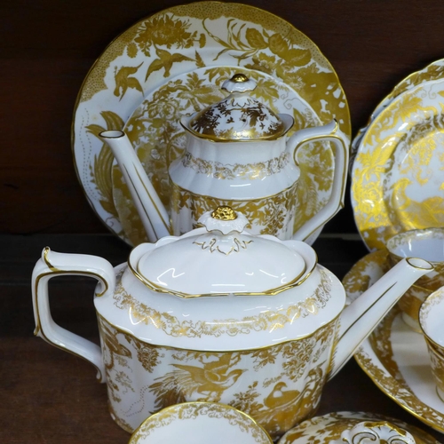 744 - Royal Crown Derby Gold Aves tea ware, teapot, coffee pot, six cups, six saucers (5+1), two large pla... 