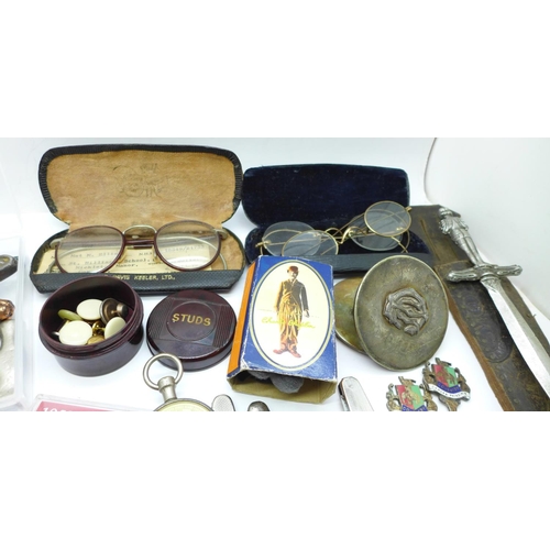 745 - Three pairs of spectacles, penknives, commemorative crowns, souvenir spoons, etc.