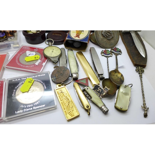 745 - Three pairs of spectacles, penknives, commemorative crowns, souvenir spoons, etc.