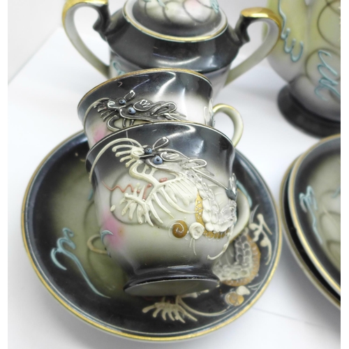 747 - An oriental six setting tea set with Geisha girl base in the cups, one saucer a/f