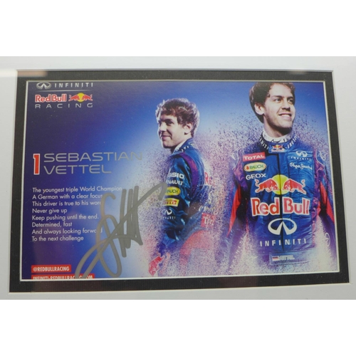 748 - A framed signed photograph of triple Formula 1 World Champion Sebastian Vettel