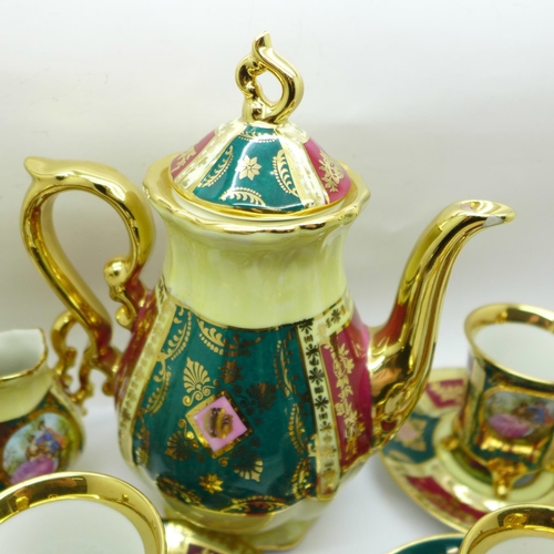 751 - A porcelain six setting coffee service with gilt decoration and classical scenes, marked Bavaria and... 