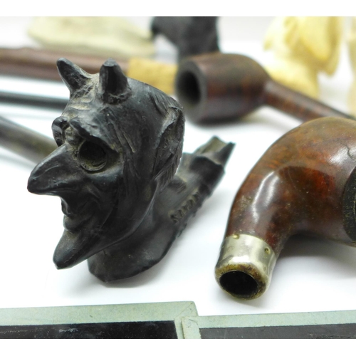 796 - Assorted items; pipes, small flask, cast metal bull, 19th Century candle snuff, glass slides, etc.