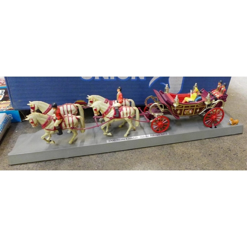 833 - A Corgi Silver Jubilee coach on a plastic plinth, Airfix scale kit soldiers and astronauts and other... 