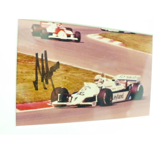 834 - A frame of signed photographs of three F1 World Champions; 1980 Alan Jones (Williams), 2007 Kimi Rai... 