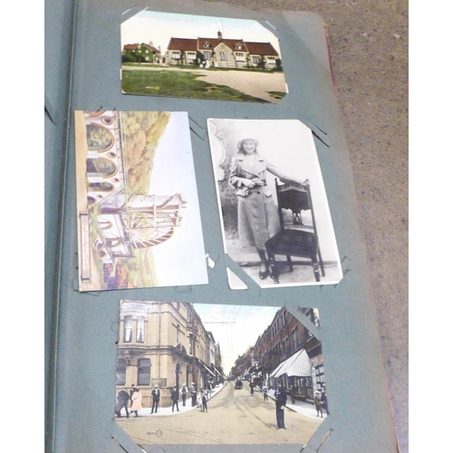 854 - A postcard album and postcards