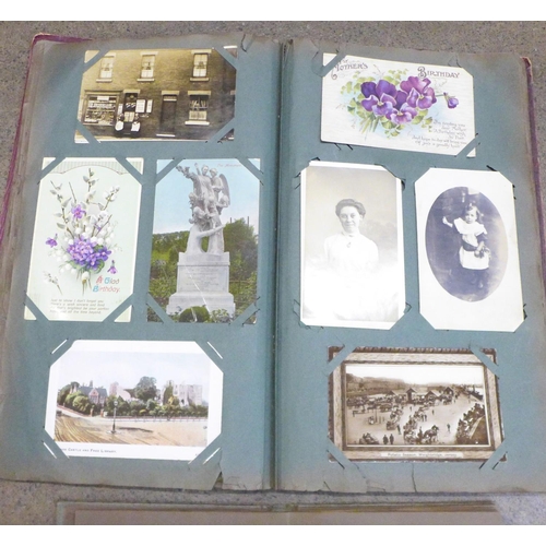 854 - A postcard album and postcards