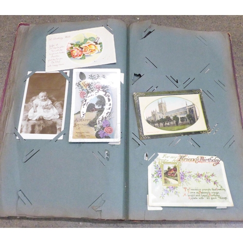 854 - A postcard album and postcards