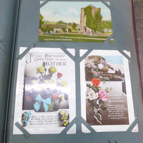 854 - A postcard album and postcards