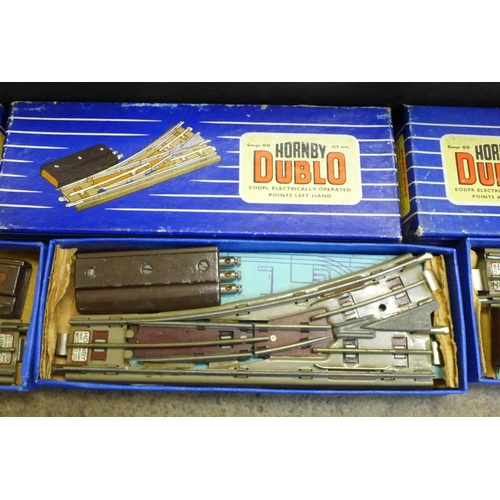 862 - A box of Hornby Dublo OO gauge points, switches, (boxed), plus curves and straight track