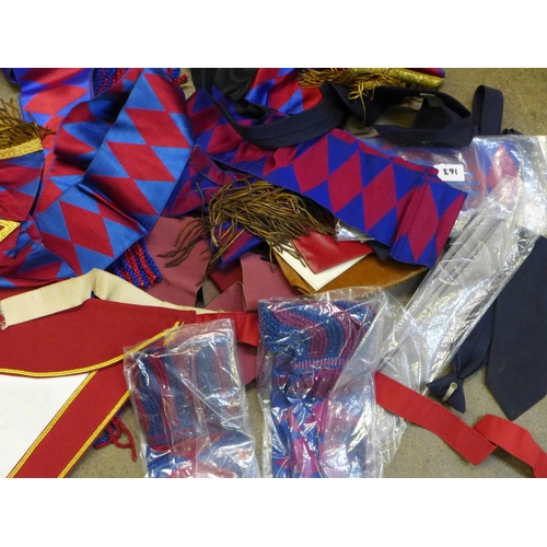 866 - A box of Masonic regalia, ties, rule books, etc.