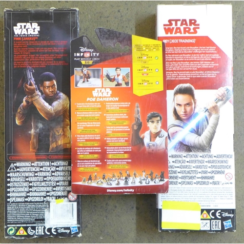 873 - Three boxed Star Wars figures, Finn (Jakku), Rey (Jedi Training) and Poe Dameron