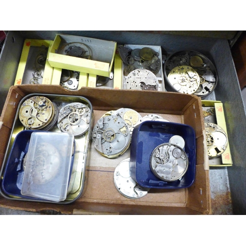 874 - A metal cabinet of watch movements in parts