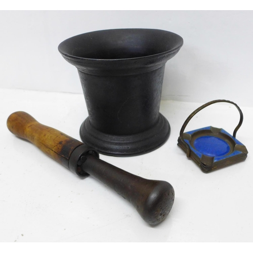 893 - A pestle and mortar and an enamelled ashtray set