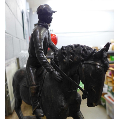 894 - A bronze figure of a horse and jockey, after Pierre Jules Mene, width of base 46cm