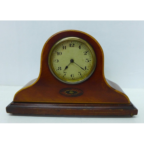 904 - An inlaid mantel clock, brass bezel