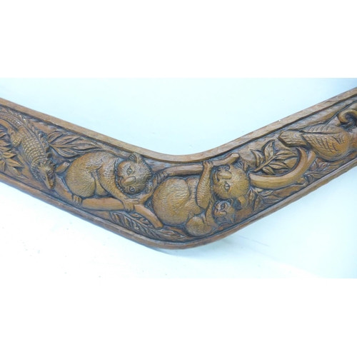 907 - A carved boomerang wall plaque, signed F. Rentz