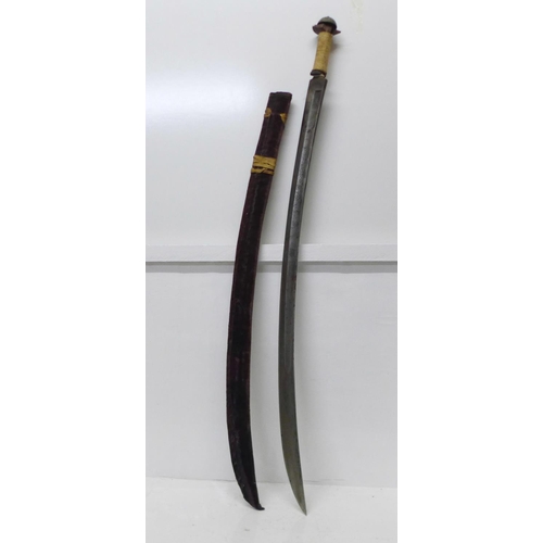 914 - An Indian tulwar, etched blade, lacking hilt, wooden handle a/f, blade 78cm, velvet covered scabbard