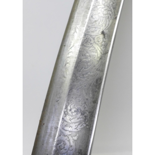 914 - An Indian tulwar, etched blade, lacking hilt, wooden handle a/f, blade 78cm, velvet covered scabbard