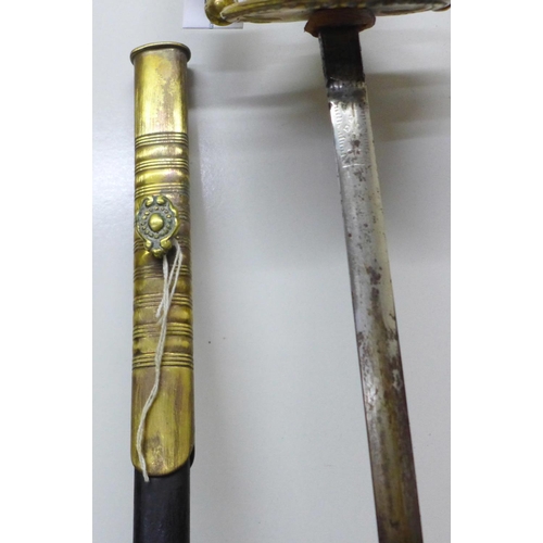 918 - A continental sword with leather and brass scabbard, gilt brass handle, length of blade 79cm