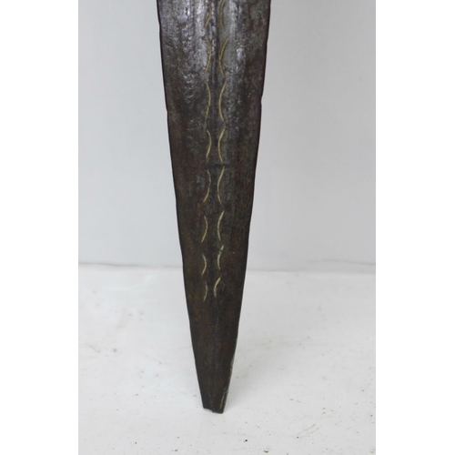 919 - An African tribal sword with wooden handle, etched blade, blade 69cm