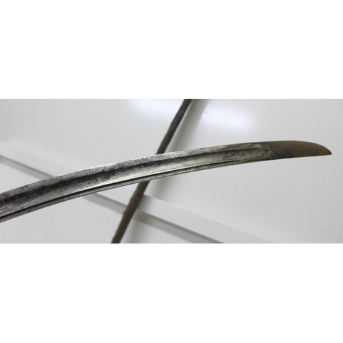 923 - An African curved sword with horn handle and leather scabbard, blade 87cm