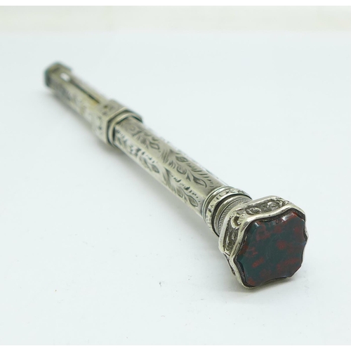 937 - A baby's white metal rattle and a white metal pencil set with bloodstone, both test as silver