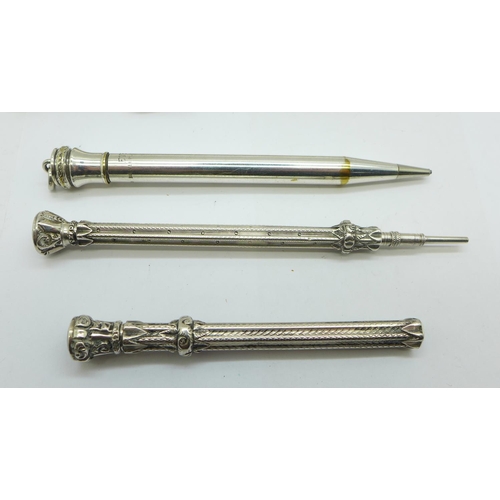 941 - A hallmarked silver Eversharp pencil, two white metal push pencils and two silver plated Eversharp p... 