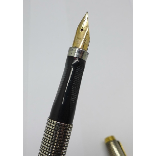 957 - A 1960's sterling silver Parker pen with 14ct gold nib