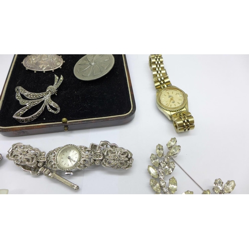 994 - Costume jewellery; two wristwatches, a Victorian silver brooch, other brooches and a bracelet