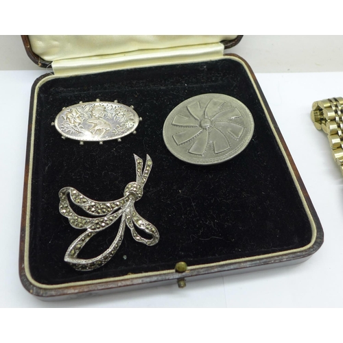 994 - Costume jewellery; two wristwatches, a Victorian silver brooch, other brooches and a bracelet