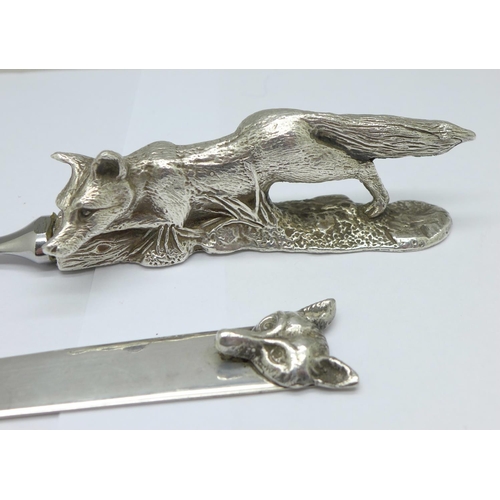 999 - A letter opener with heavy hallmarked silver fox handle, chrome metal blade, Birmingham 1988, Albert... 