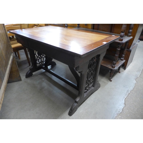 100 - A Victorian Gothic Revival oak library table (later top), 72cms h ,116cms w, 69cms d