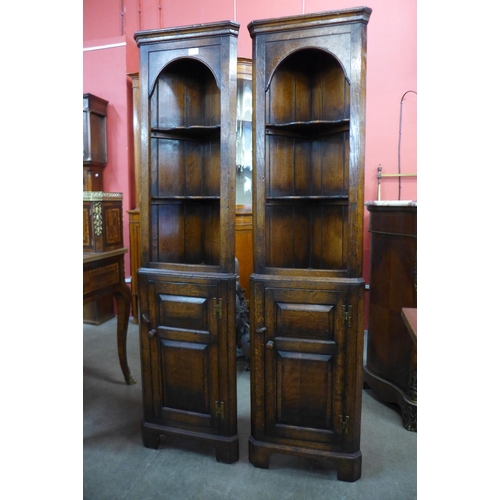 103 - A pair of Titchmarsh & Goodwin Ipswich oak freestanding corner cabinets, 167cms h