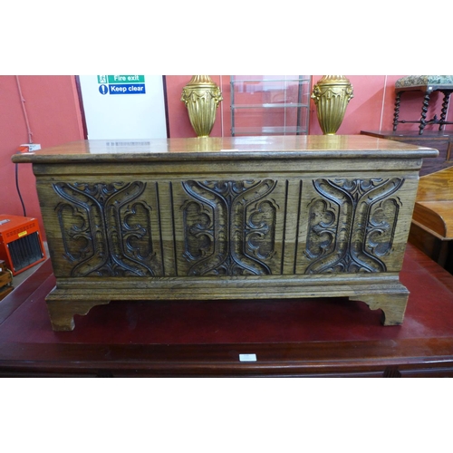 109 - A 17th Century style carved oak blanket box, 47cms h, 94cms w, 37cms d.