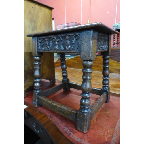 117 - A 17th Century style carved oak stool