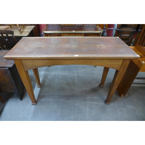 120 - An Arts and Crafts oak altar table, 86cms h, 130cms L, 53cms w.