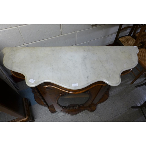 123 - A Victorian burr walnut and marble topped serpentine credenza, 88cms h, 122cms w, 41cms d.