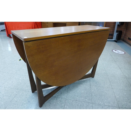 132 - A teak drop-leaf table