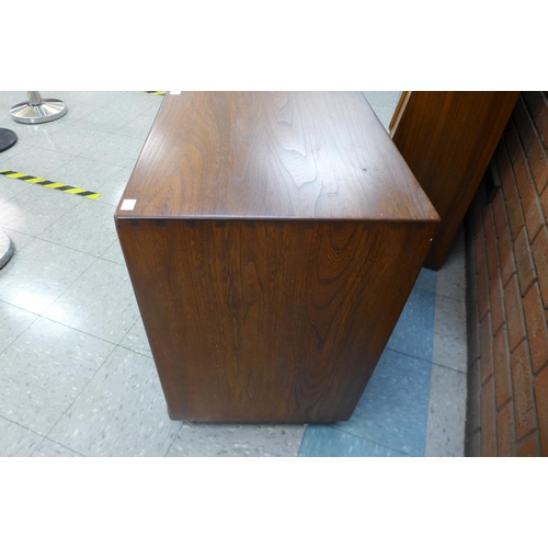 134 - An Ercol Golden Dawn elm Windsor sideboard