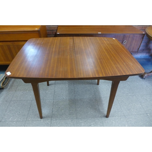 136 - An afromosia extending dining table