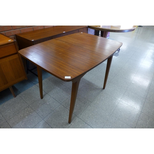 136 - An afromosia extending dining table