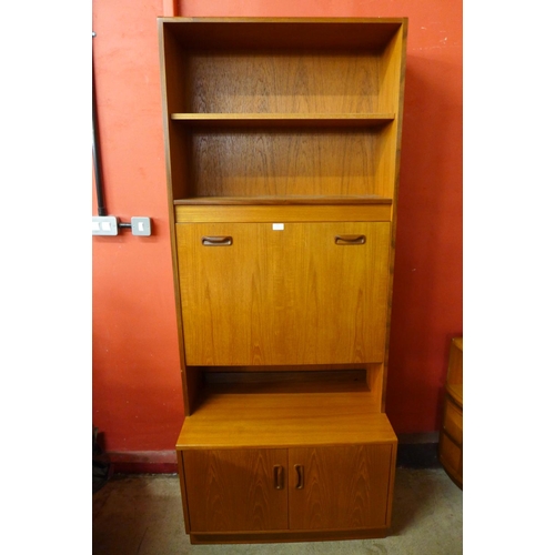 137 - A G-Plan Sierra teak bookcase and a teak drop leaf table