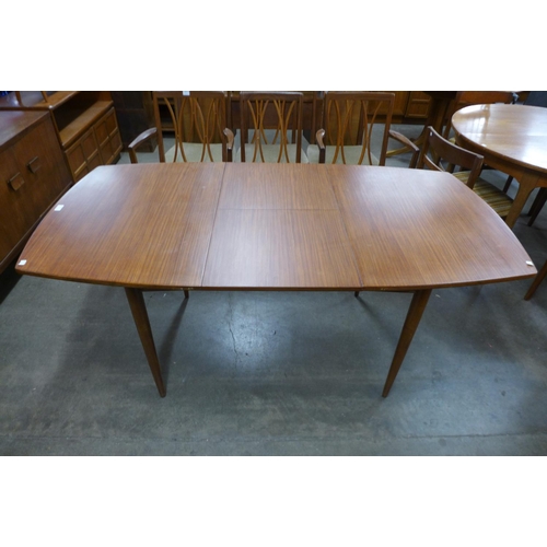 156 - A teak extending dining table