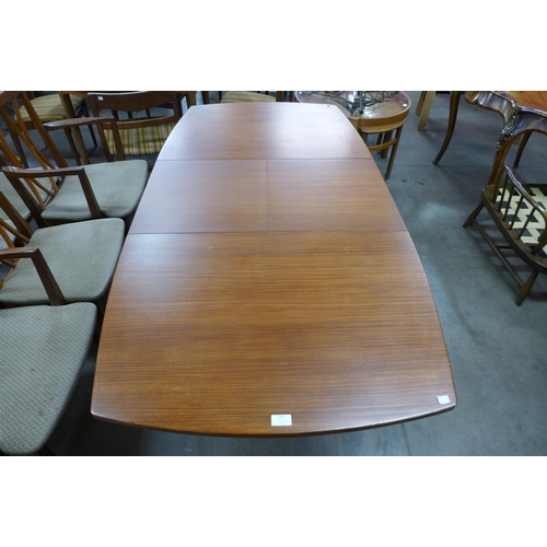 156 - A teak extending dining table